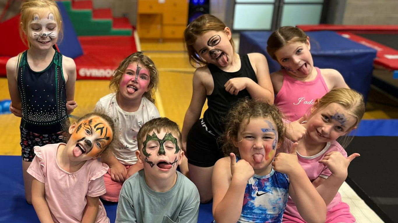 children with their faces painted enjoying a party at north east gymnastics academy 