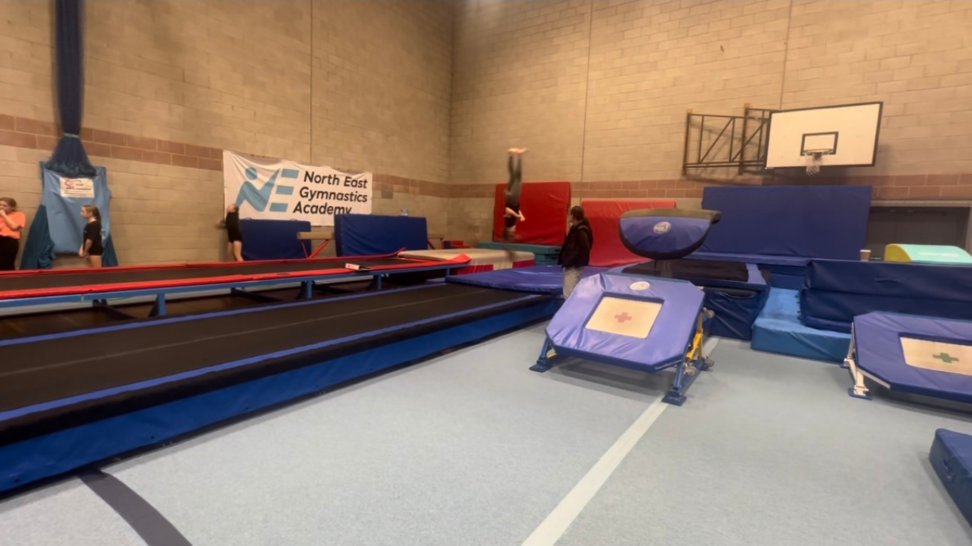 a gymnast on the tumble track 